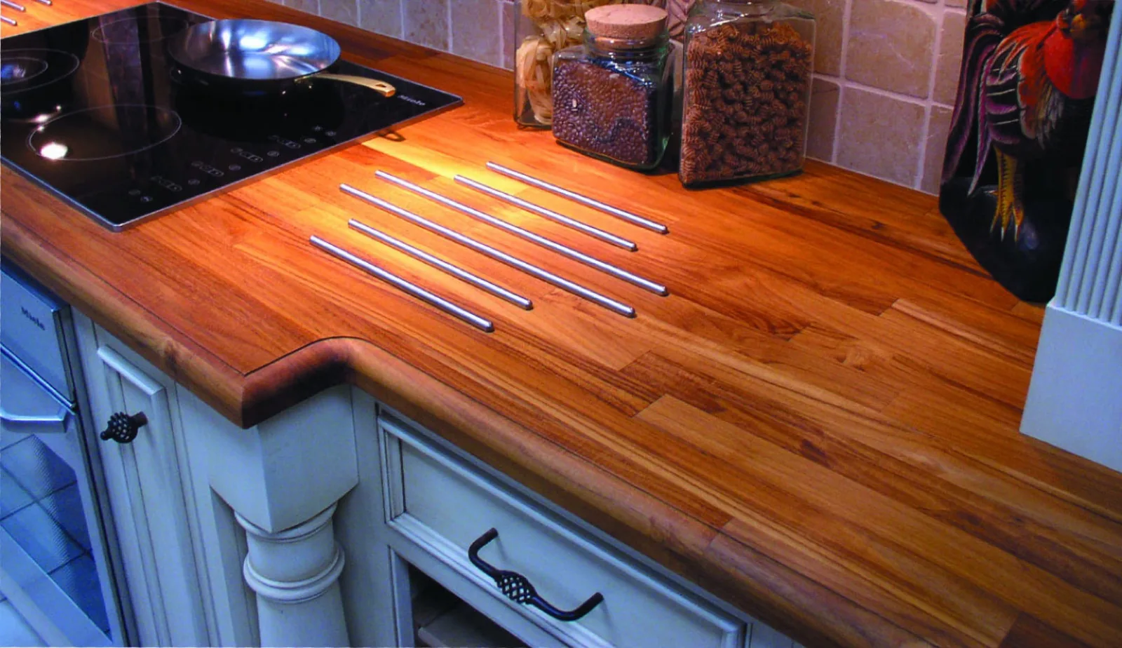 Teak wood counter top with integrated heat bars by Cafe Countertops